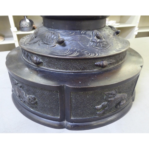 351 - A Japanese bronze finished, metal temple censer with a pagoda top, over a pierced bowl, on a pedesta... 