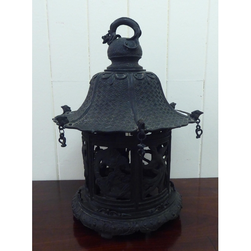 352 - A Chinese bronze finished, metal hanging lantern of pagoda design  14