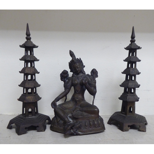 356 - Oriental collectables: to include a pair of bronze finished metal stupas  9