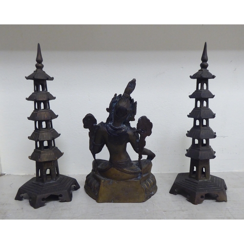 356 - Oriental collectables: to include a pair of bronze finished metal stupas  9