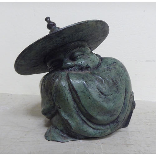 356 - Oriental collectables: to include a pair of bronze finished metal stupas  9