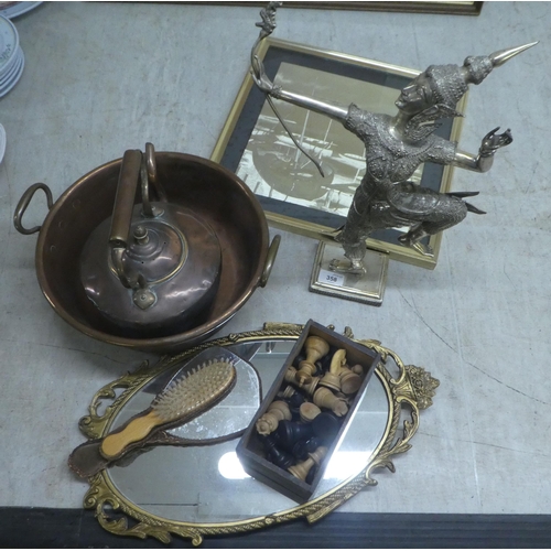 358 - A mixed lot: to include two items of vintage copper cookware; and a modern silvered figure of a Thai... 