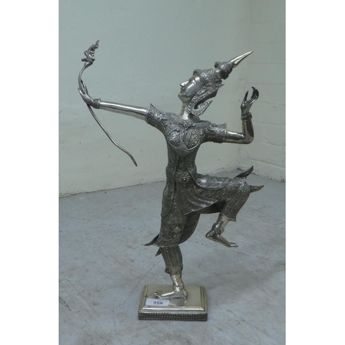 358 - A mixed lot: to include two items of vintage copper cookware; and a modern silvered figure of a Thai... 