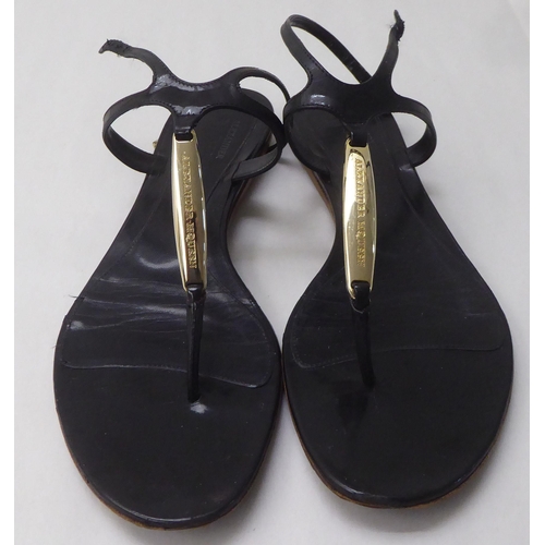 38 - A pair of ladies Alexander McQueen black leather sandals  approx. size 39 with a dust bag