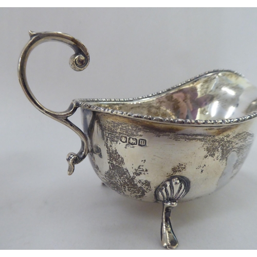 380 - Silver and white metal collectables: to include a sauce boat, on splayed feet&nbsp; Sheffield marks ... 