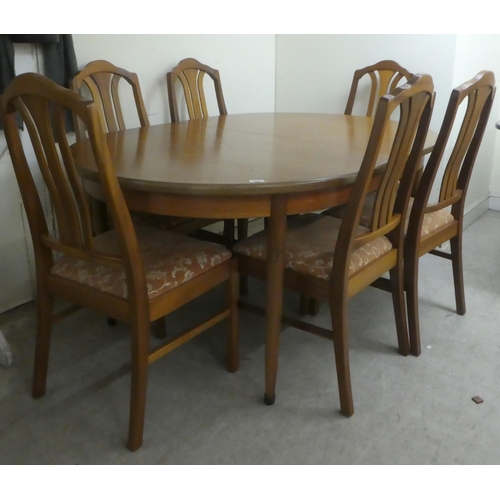 384 - A G-Plan teak dining table, raised on turned, tapered legs  29