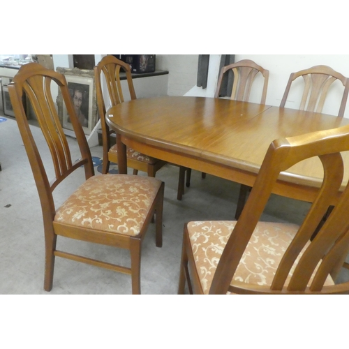 384 - A G-Plan teak dining table, raised on turned, tapered legs  29