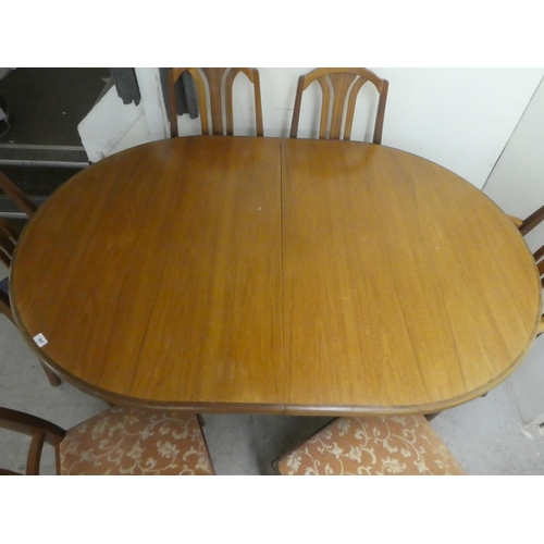 384 - A G-Plan teak dining table, raised on turned, tapered legs  29