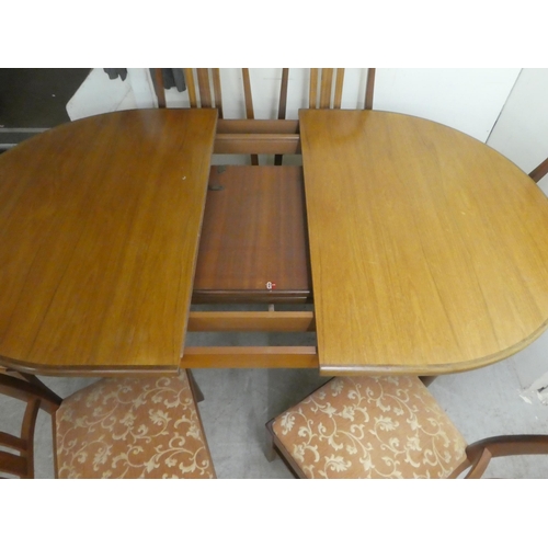 384 - A G-Plan teak dining table, raised on turned, tapered legs  29