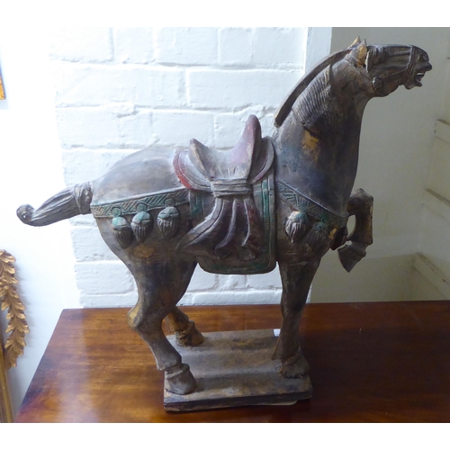 56 - A modern gilt, overpainted softwood model, a horse  23