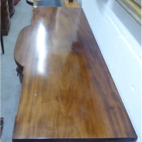 57 - A George III mahogany breakfront sideboard with two central drawers, flanked by two cellarette drawe... 