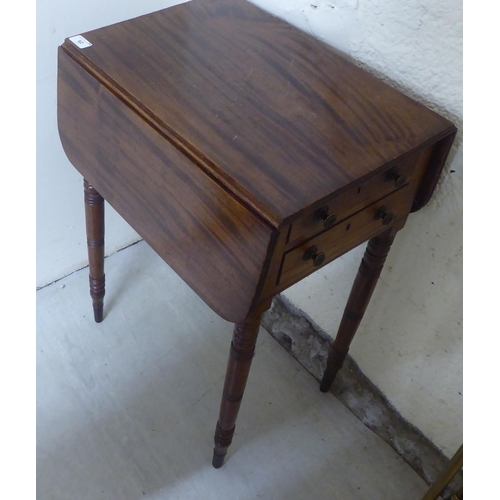 62 - A late 19thC mahogany Pembroke work table with two end drawers, raised on ring turned, tapered legs ... 