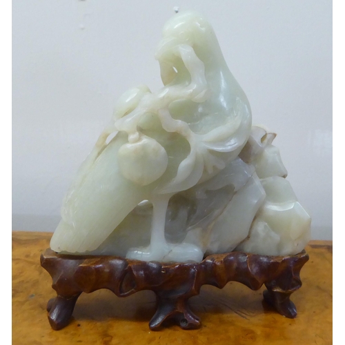 63 - A 20thC carved jade coloured hardstone model, a bird  4