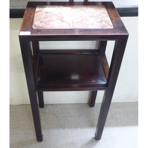 67 - A mid 20thC Chinese fruitwood two tier hall table, raised on square legs  32