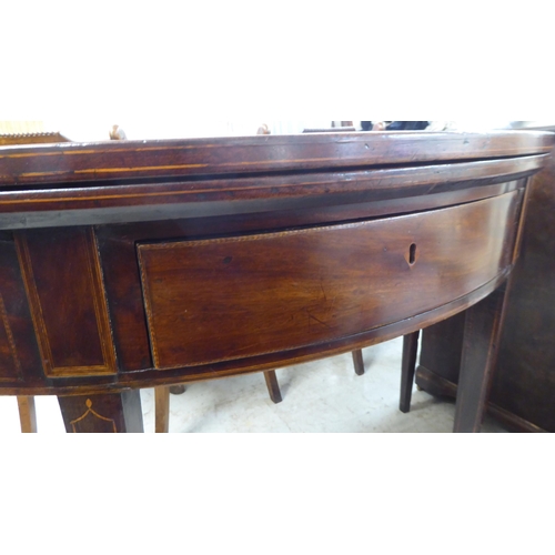 76 - A George III string inlaid mahogany D-end tea table, raised on a rear gateleg action and square, tap... 