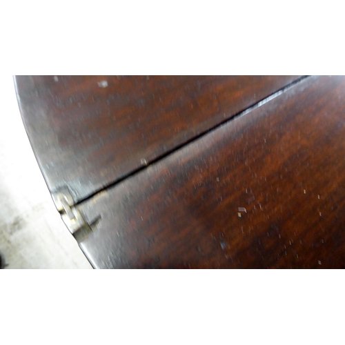 76 - A George III string inlaid mahogany D-end tea table, raised on a rear gateleg action and square, tap... 