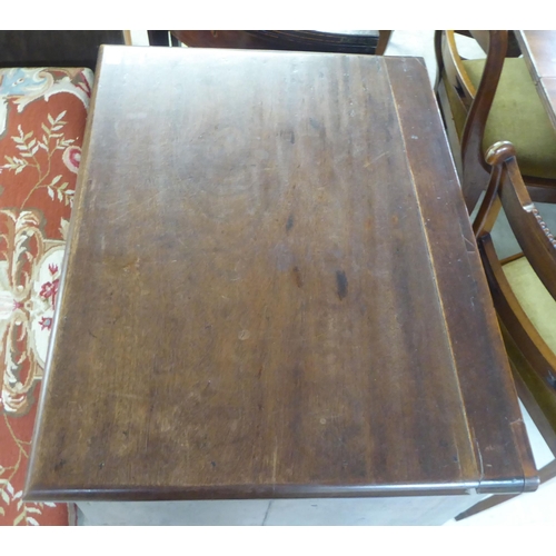 77 - An early/mid 19thC mahogany finished four drawer dressing chest, raised on bracket feet  30