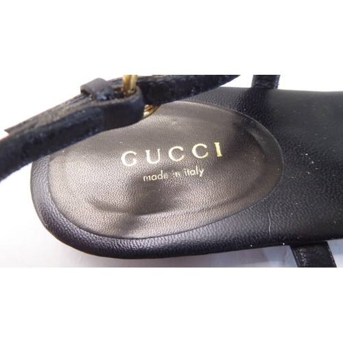 8 - A pair of ladies Gucci black leather sandals  size 39 with a dust bag