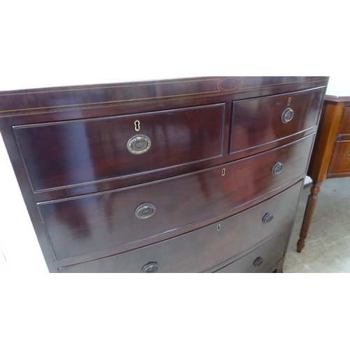 82 - A George III and later polished string and ebony inlaid crossbanded mahogany bow front, five drawer ... 