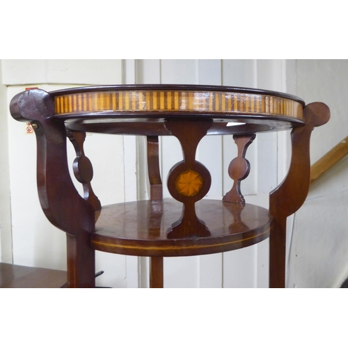 91 - An Edwardian string inlaid mahogany three tier plant stand, raised on splayed feet  47