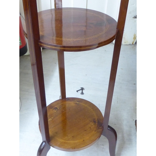 91 - An Edwardian string inlaid mahogany three tier plant stand, raised on splayed feet  47