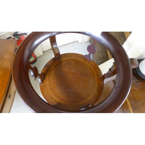 91 - An Edwardian string inlaid mahogany three tier plant stand, raised on splayed feet  47