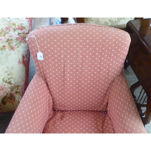 99 - An early 20thC and later fabric covered nursing chair, raised on square, tapered legs and casters&nb... 