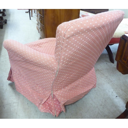 99 - An early 20thC and later fabric covered nursing chair, raised on square, tapered legs and casters&nb... 