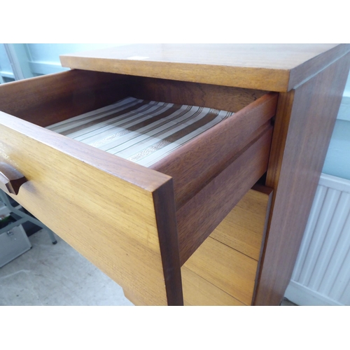 103 - A G-Plan teak dressing chest with six drawers, raised on splayed legs  45