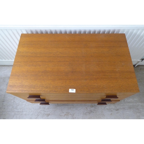 104 - A G-Plan teak dressing chest with three drawers, raised on splayed legs  28