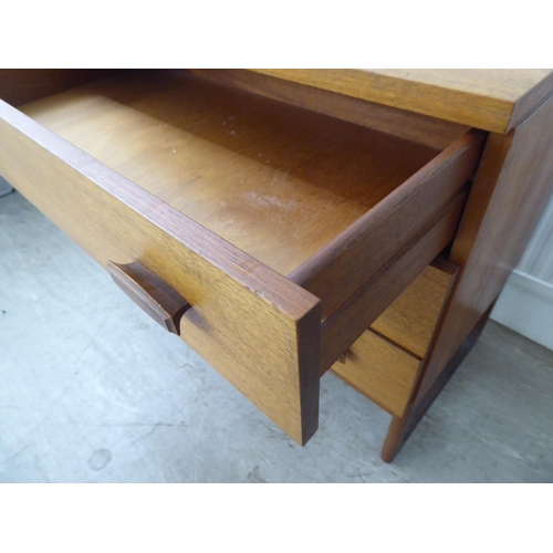 104 - A G-Plan teak dressing chest with three drawers, raised on splayed legs  28