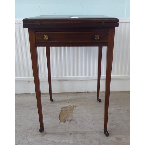 105 - An Edwardian satinwood inlaid mahogany envelope card table, raised on square, tapered legs and caste... 