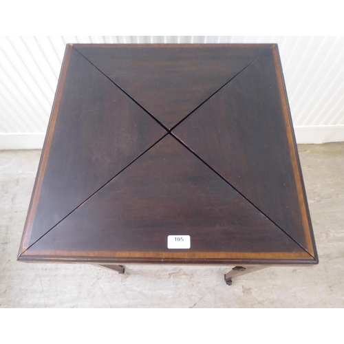 105 - An Edwardian satinwood inlaid mahogany envelope card table, raised on square, tapered legs and caste... 