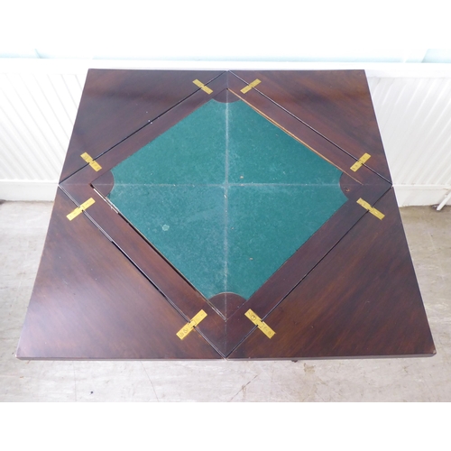 105 - An Edwardian satinwood inlaid mahogany envelope card table, raised on square, tapered legs and caste... 