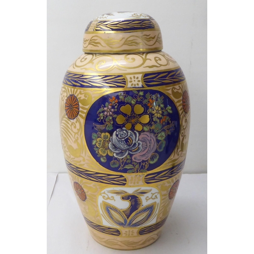 147 - Ceramics: to include an early 20thC Carlton Ware china vase and cover, decorated with flora  9