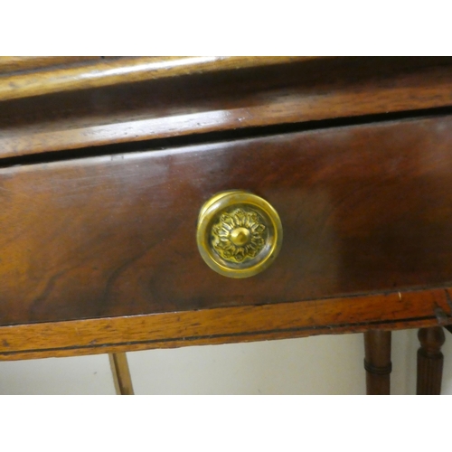 73 - A late 19thC mahogany two drawer side table, raised on ring turned, tapered legs  29