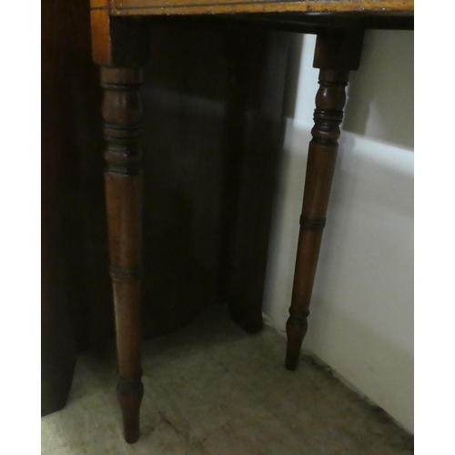 73 - A late 19thC mahogany two drawer side table, raised on ring turned, tapered legs  29