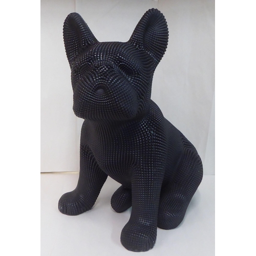121 - A black textured composition model, a seated dog&nbsp; 18