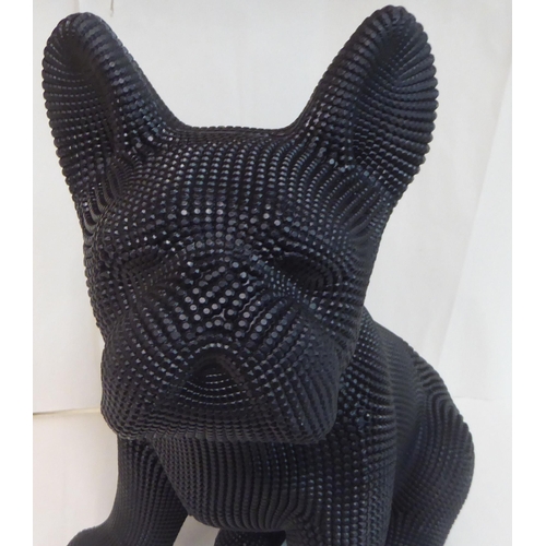 121 - A black textured composition model, a seated dog&nbsp; 18
