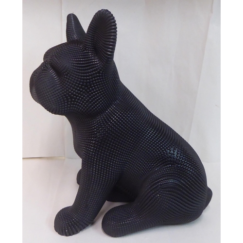 121 - A black textured composition model, a seated dog&nbsp; 18