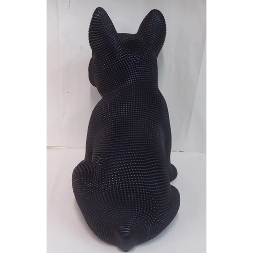 121 - A black textured composition model, a seated dog&nbsp; 18