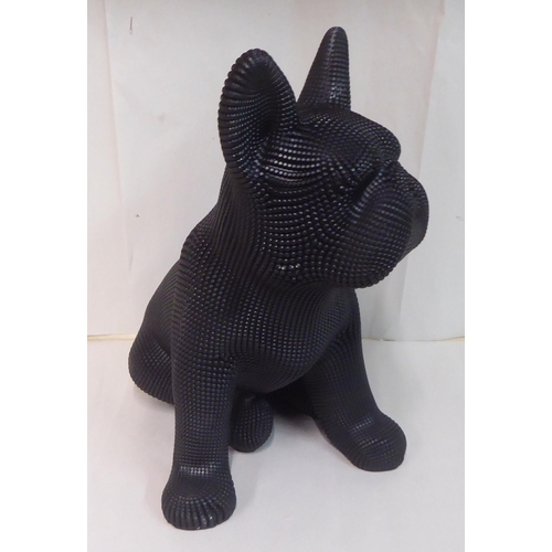 121 - A black textured composition model, a seated dog&nbsp; 18