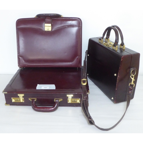 122 - Three similar brown leather brief/camera accessories cases&nbsp;