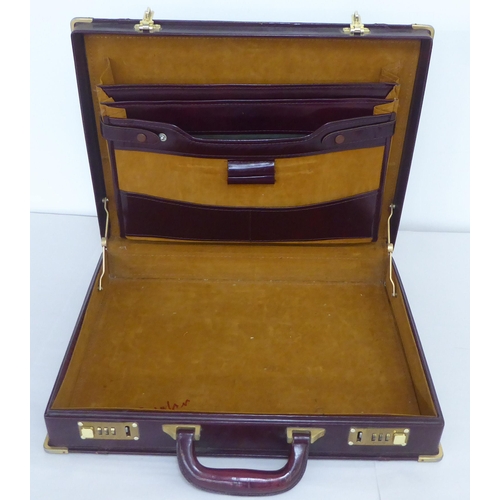 122 - Three similar brown leather brief/camera accessories cases&nbsp;