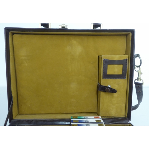 122 - Three similar brown leather brief/camera accessories cases&nbsp;