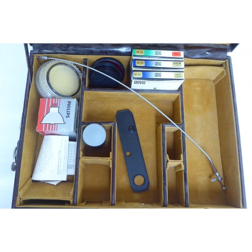 122 - Three similar brown leather brief/camera accessories cases&nbsp;