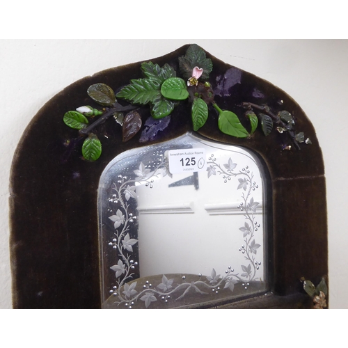 125 - A 1970s fabric covered four panelled, four shelf hanging mirror  24