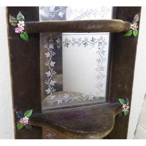 125 - A 1970s fabric covered four panelled, four shelf hanging mirror  24