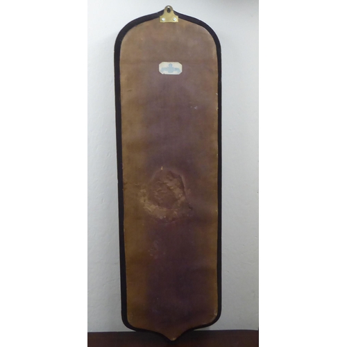 125 - A 1970s fabric covered four panelled, four shelf hanging mirror  24
