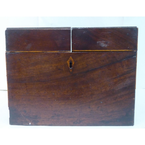 144 - A Georgian mahogany components box tantalus with straight sides and opposing brass bail handles, enc... 